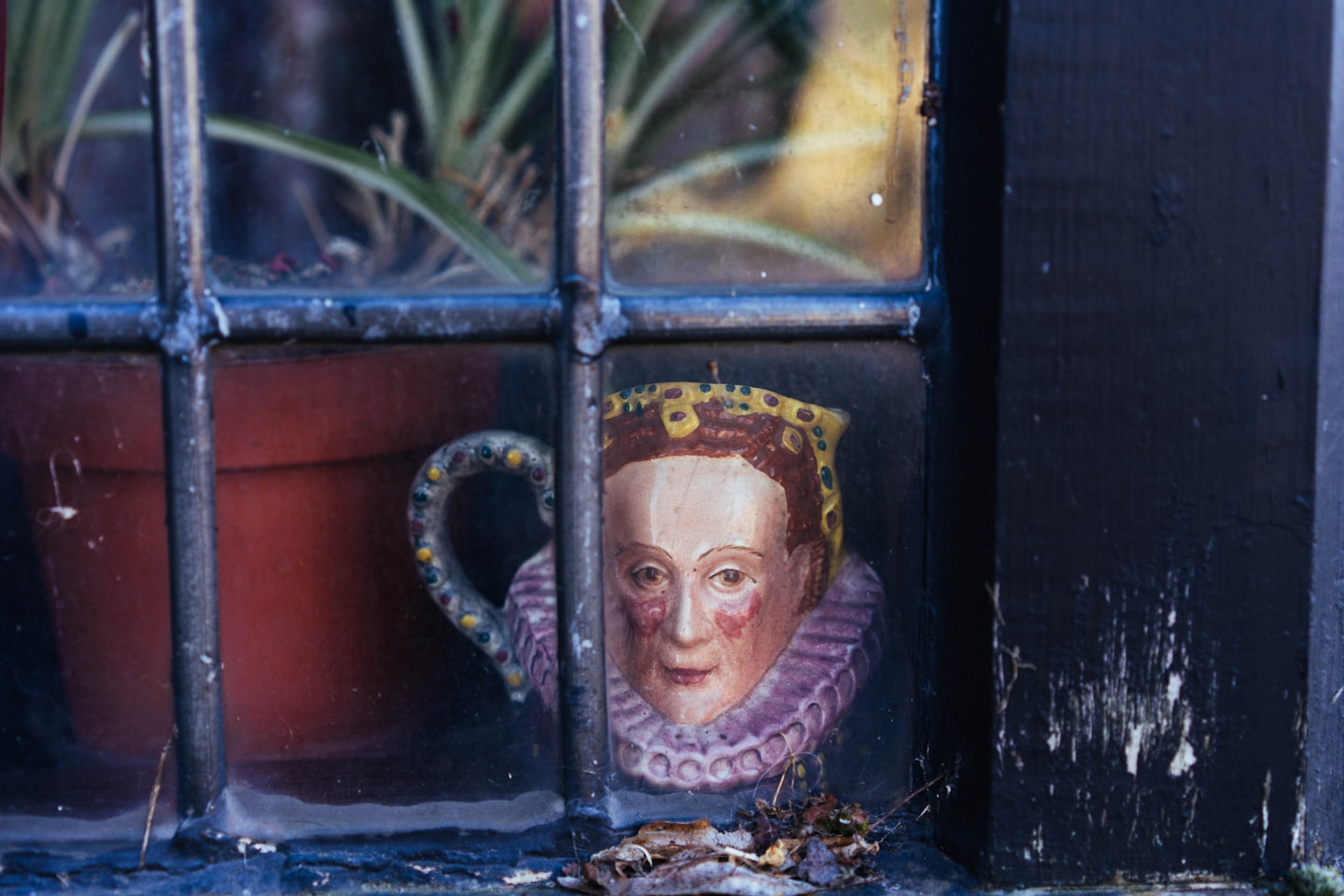 A ceramic mug with a historical figure's face.